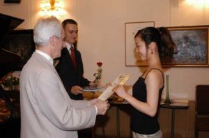 Handing of diplomas;  Juliusz Adamowski, Dariusz Adamowski, Ayaka Meiwa (Japan).   Photo: Maciej Szwed.